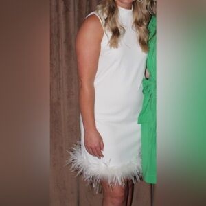 Feather trimmed dress perfect for rehearsal dinner or bridal shower